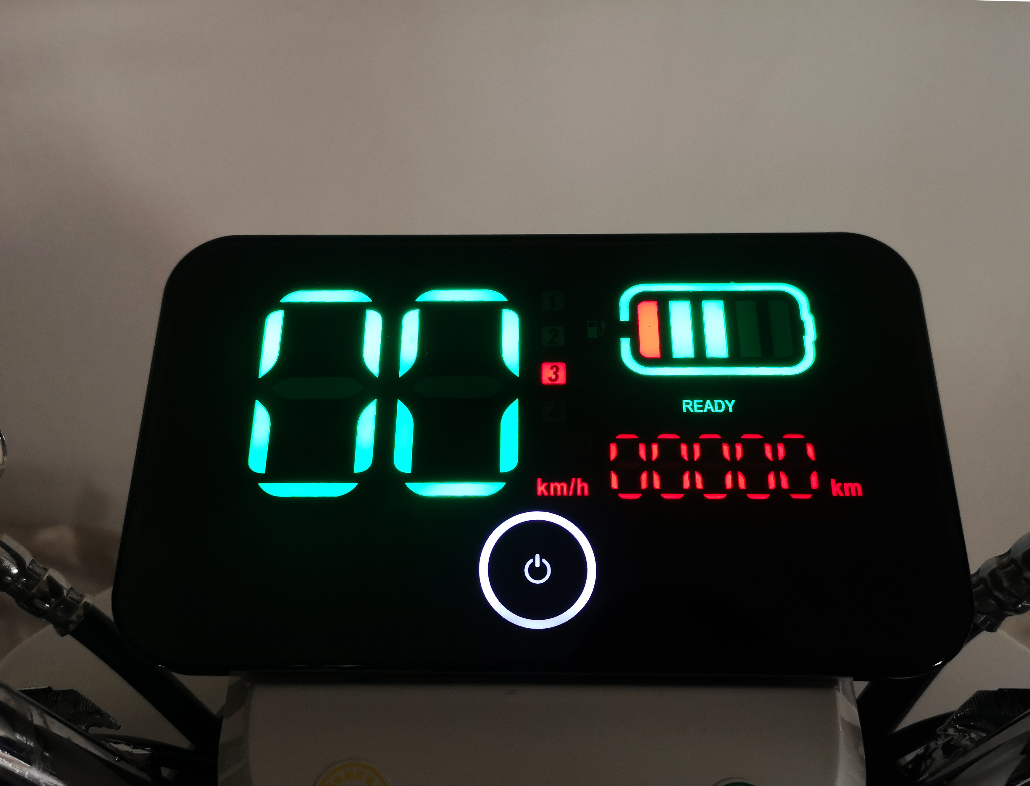 Digital display panel showing speed and battery status