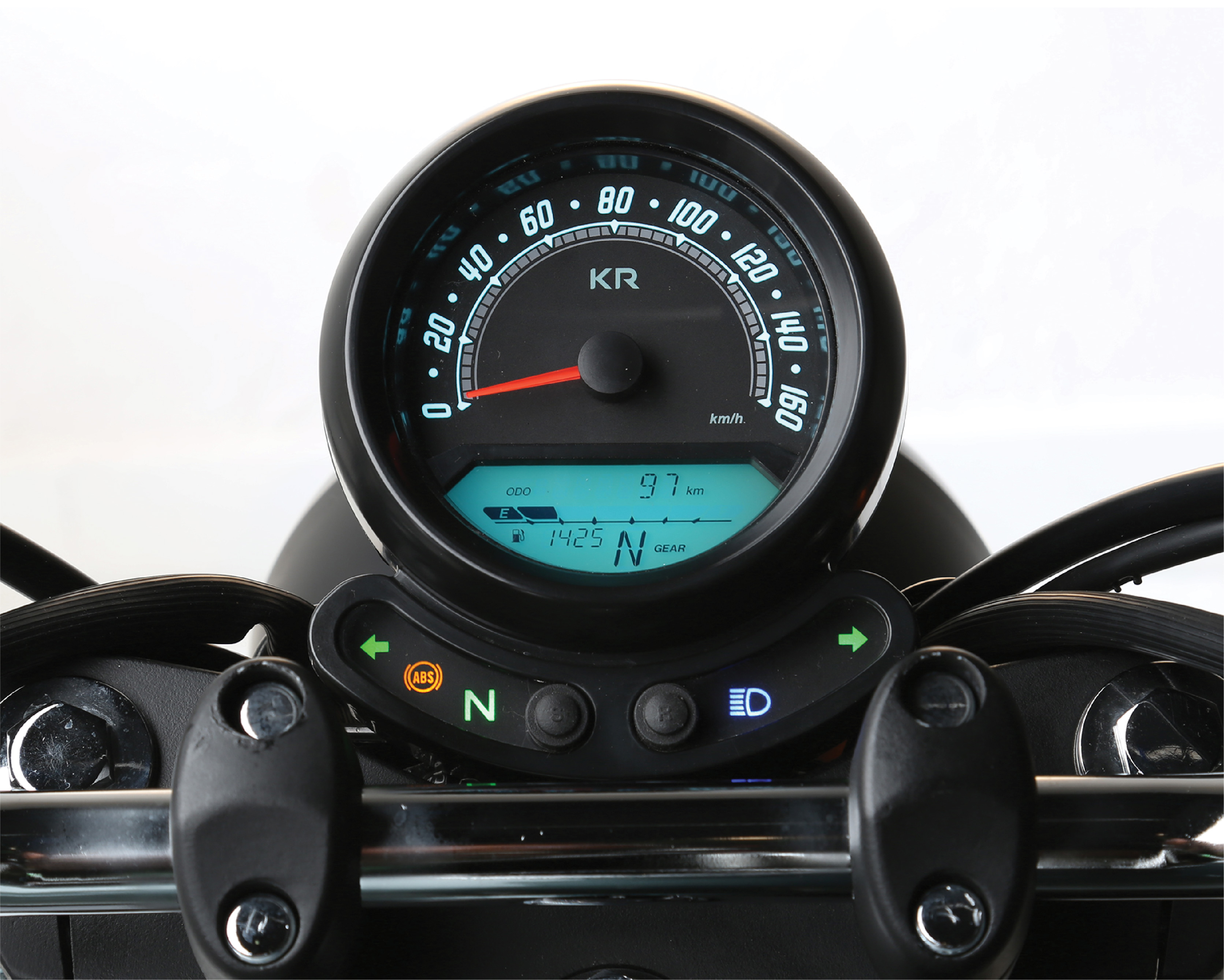 Vintage instrument panel showing speedometer and LCD display