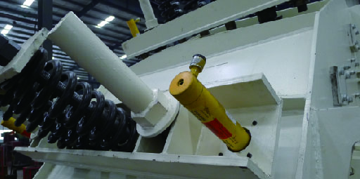 Hydraulic overload and tramp iron protection system
