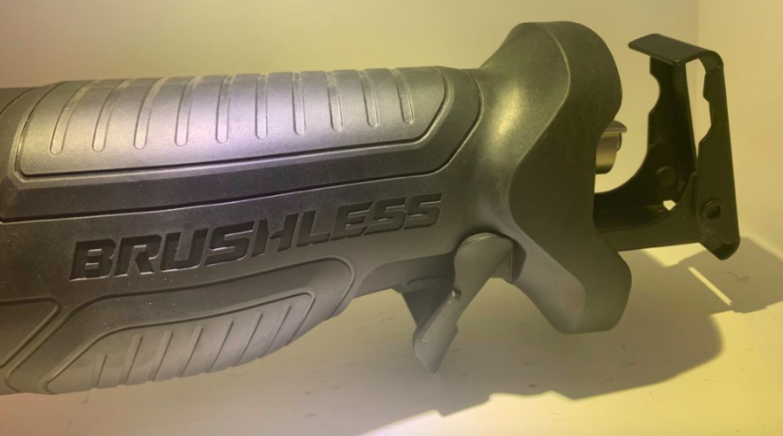 Close up of the brushless reciprocating saw showing the grip and trigger