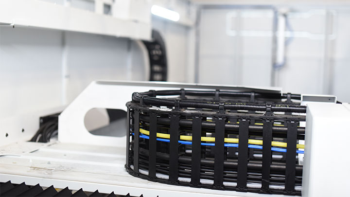 Close up of the cable management system on the laser cutting machine