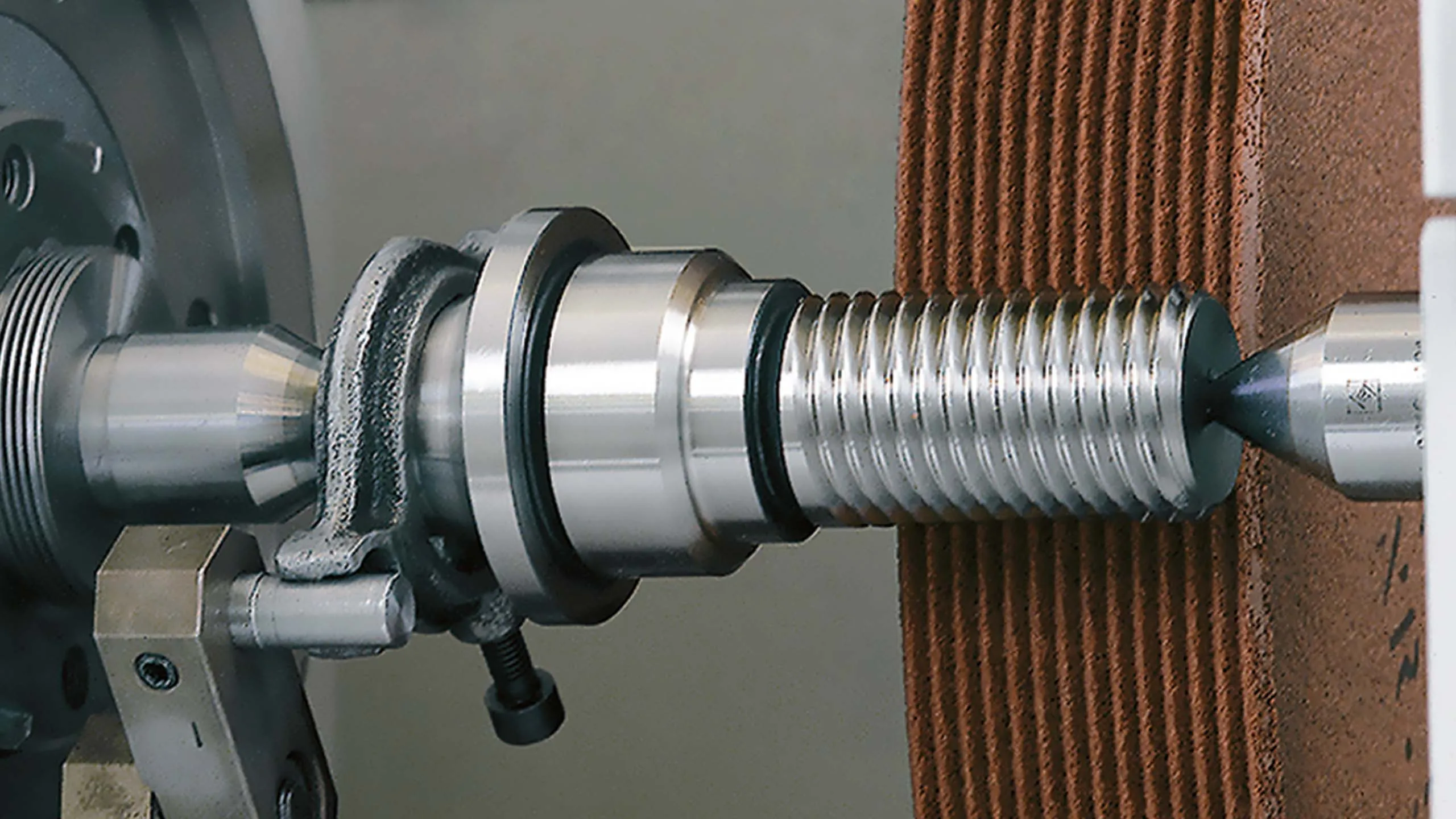 Close up of the grinding machine spindle and work area