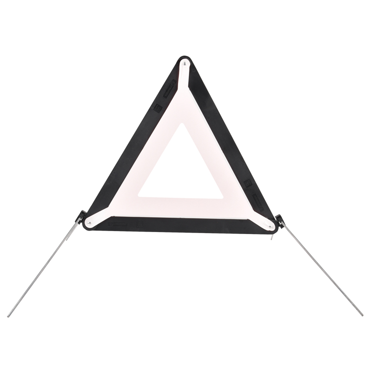 High-visibility emergency warning triangle on a road surface