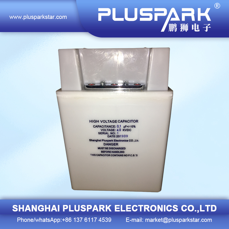 High voltage pulse capacitor unit showing safety labels and specifications