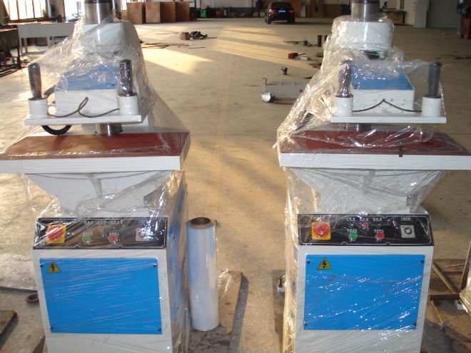 Hydraulic cutting machine in a workshop setting