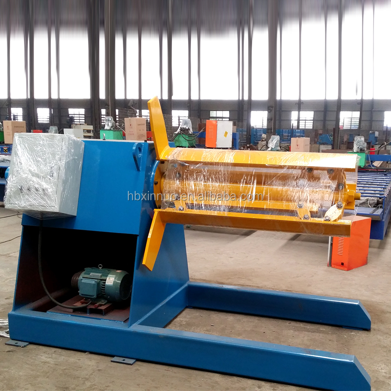 Side view of hydraulic steel coil decoiler