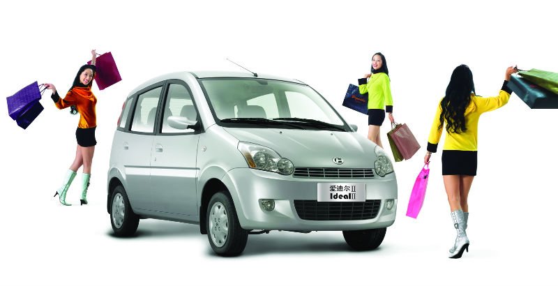 Front view of the compact sedan in an urban environment