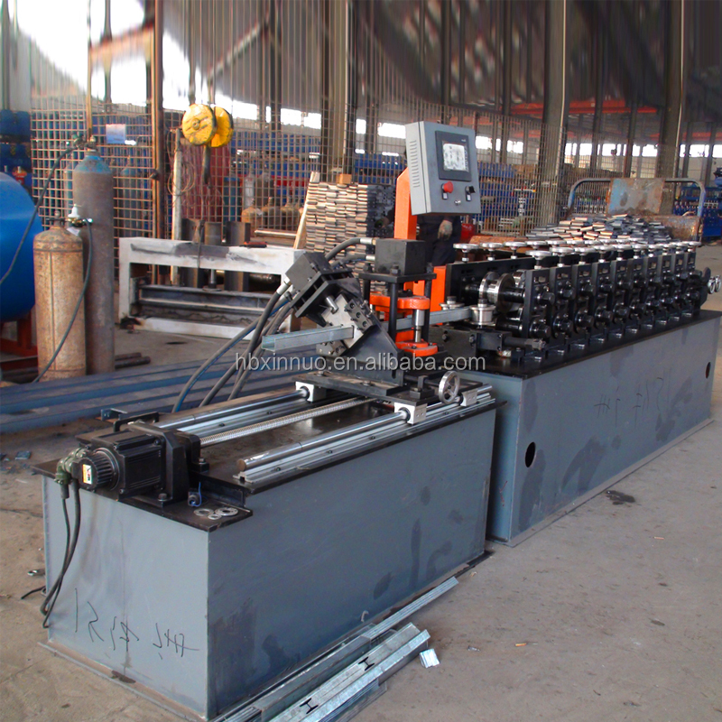 Full view of the keel roll forming machine showing uncoiler, forming stations, and control panel