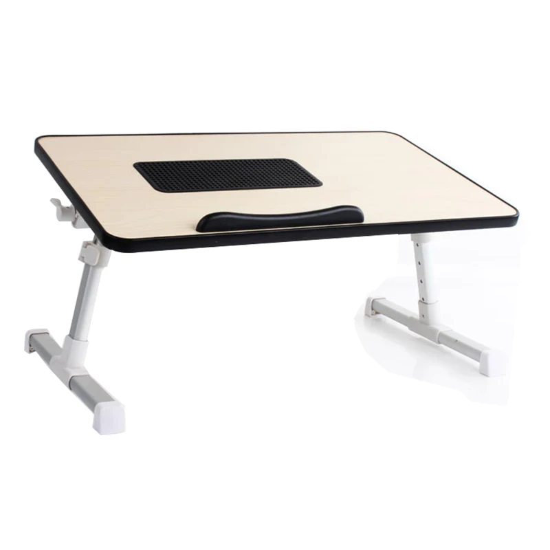 Adjustable laptop table with ventilation grill and wrist rest