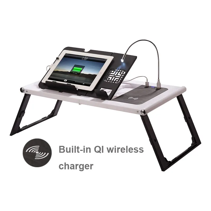 Ergonomic laptop table showing wireless charging and LED lamp features.