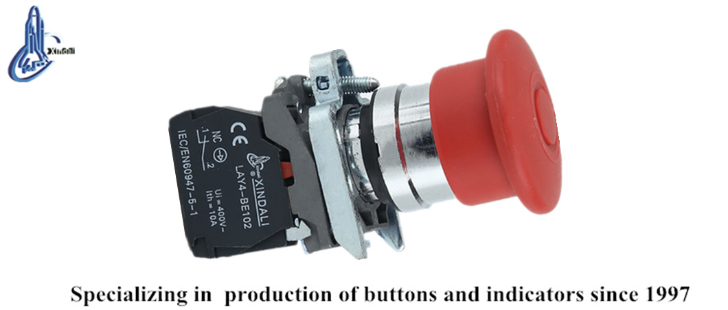 Close up of the metal emergency stop button with technical specifications listed.