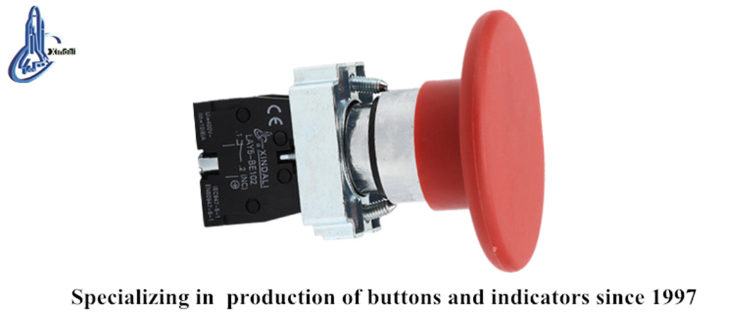 Close up view of the mushroom head switch showing contact block and terminal markings.