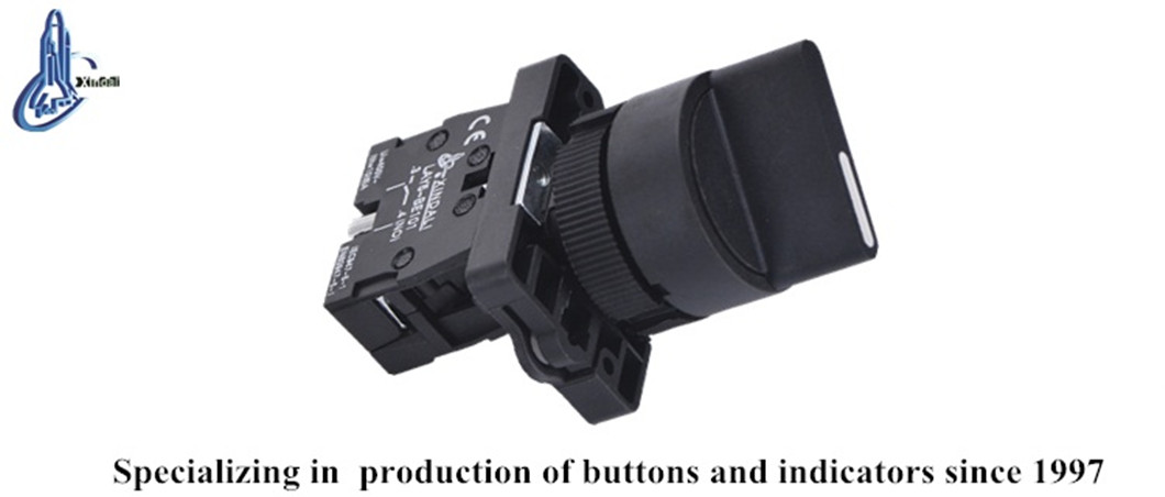 Close up view of the black push button switch selector