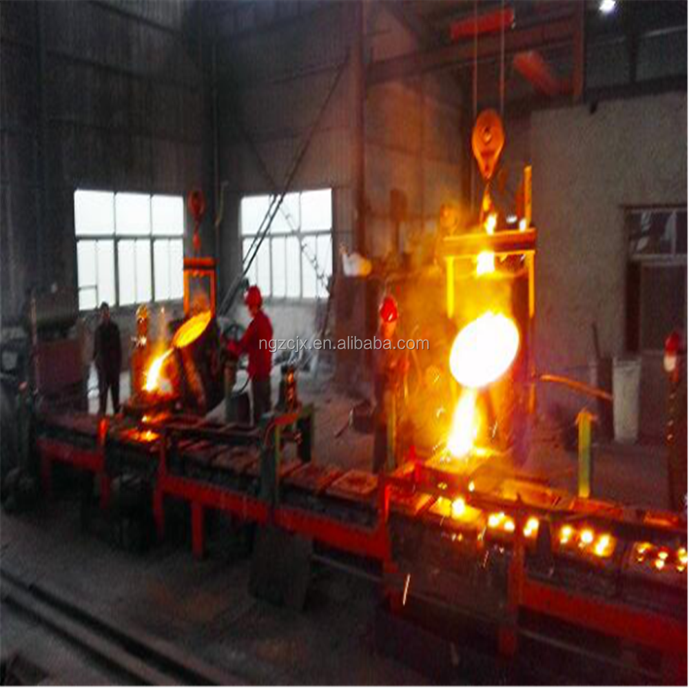 Ladle pouring molten metal into casting system