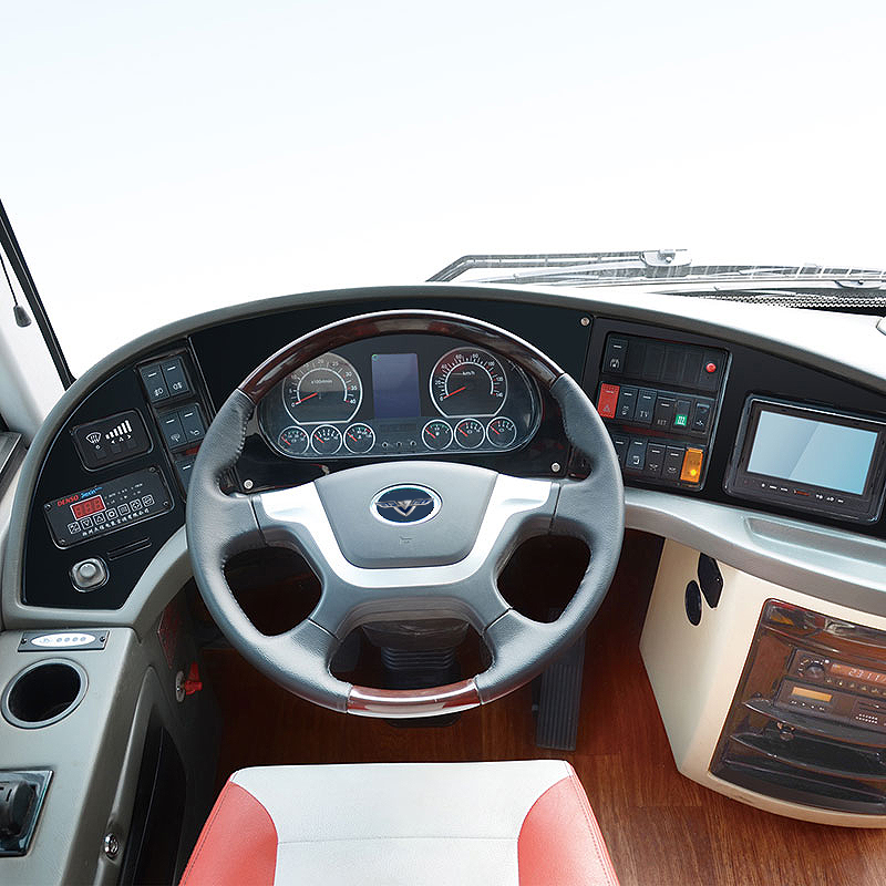Driver cockpit of the LHD coach featuring digital displays and controls.