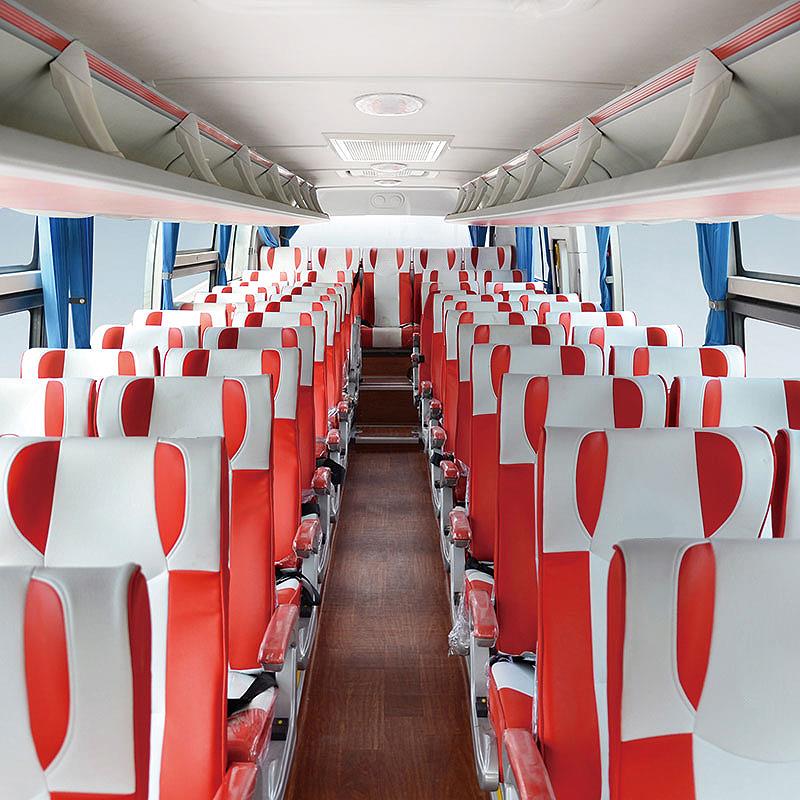 Interior passenger cabin with red and white seats.