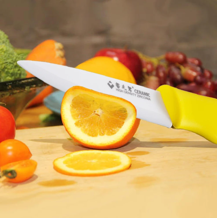 Close up of the ceramic folding knife showing blade sharpness and ergonomic handle design.