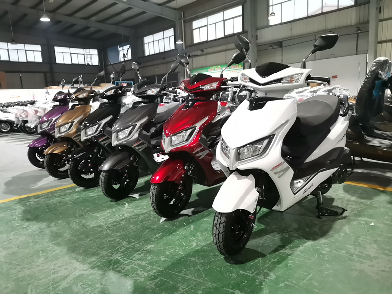 Lineup of M8 scooters showing different color finishes.