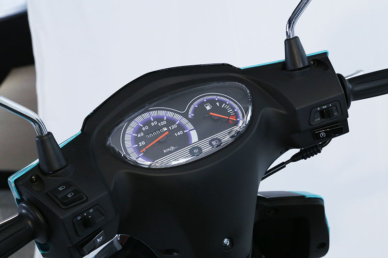 Close-up of the scooter dashboard and instrument panel.