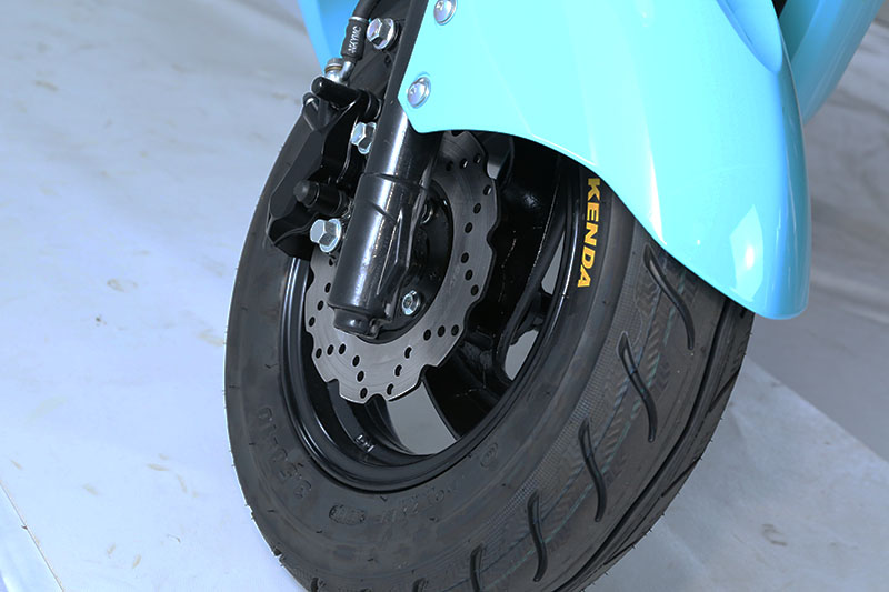 Close-up of the front wheel and disc brake assembly.
