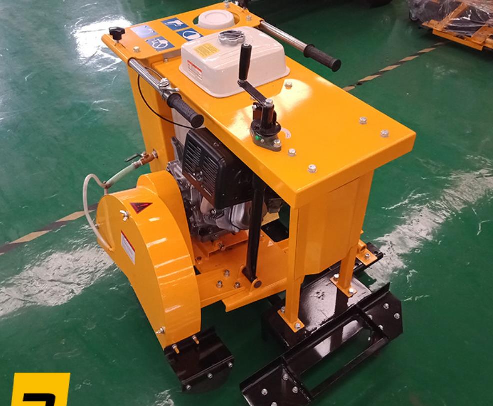 Close up of the road cutting machine showing engine and controls