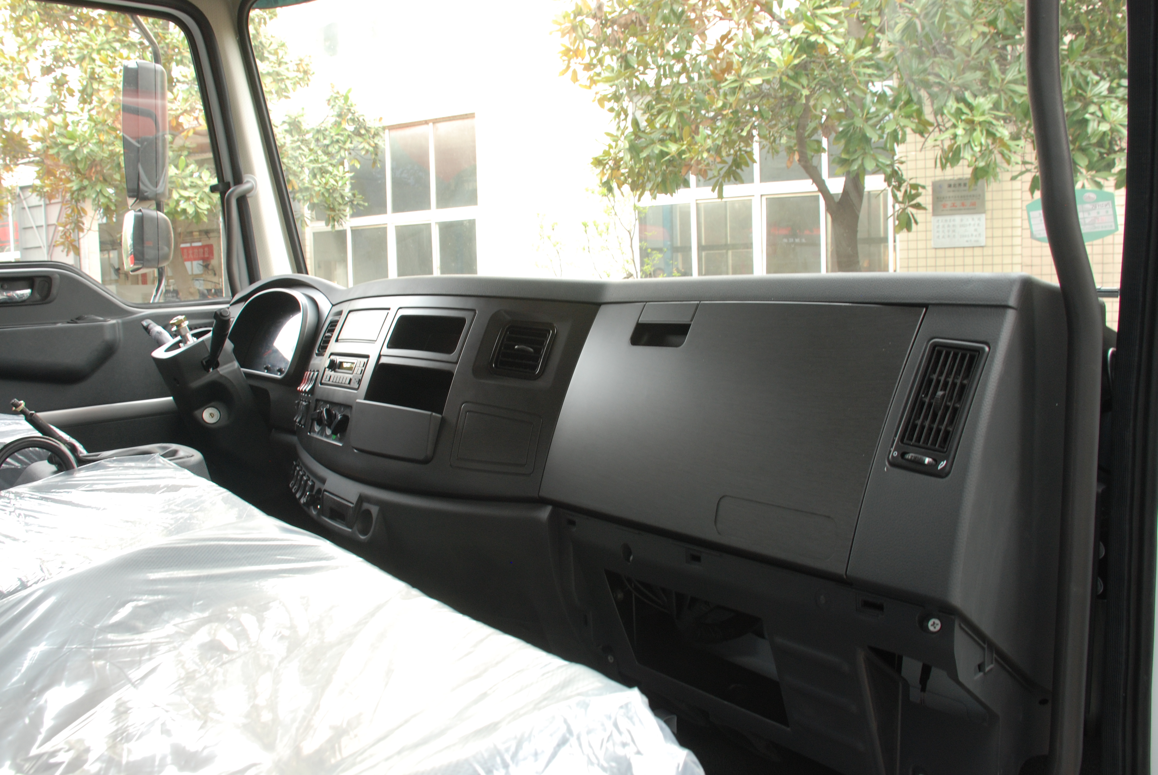 Interior dashboard view of the PW15D truck cab
