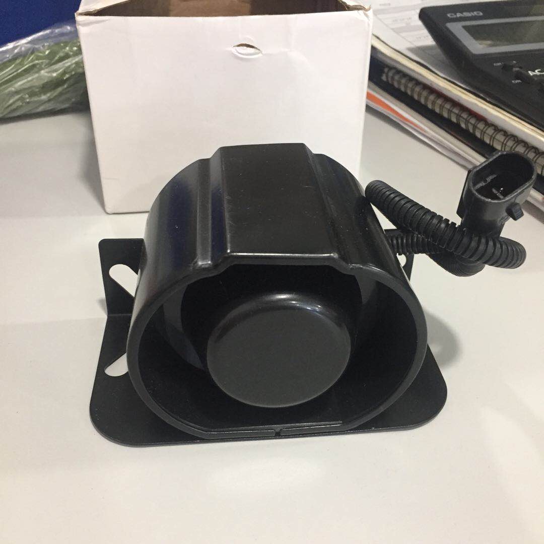 Heavy-duty metal housing backup alarm for mining and construction vehicles.
