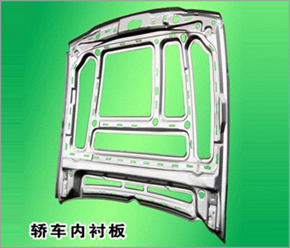 Stamped Metal Component with Ribs and Cutouts