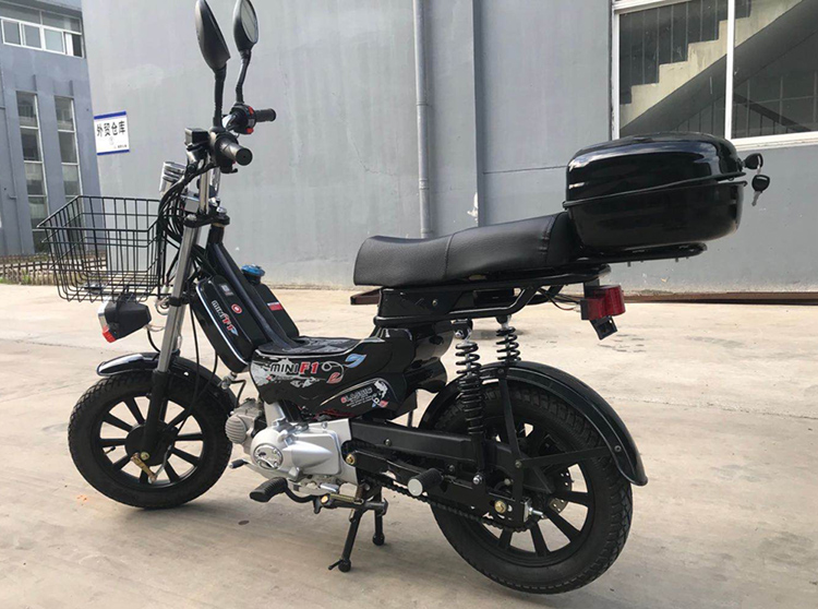 Mini motorcycle parked showing compact size