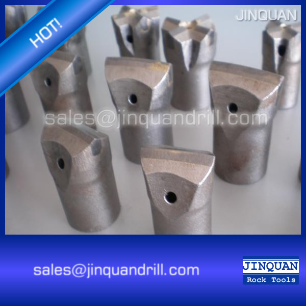 Close up of tapered chisel bit showing carbide cutting edge