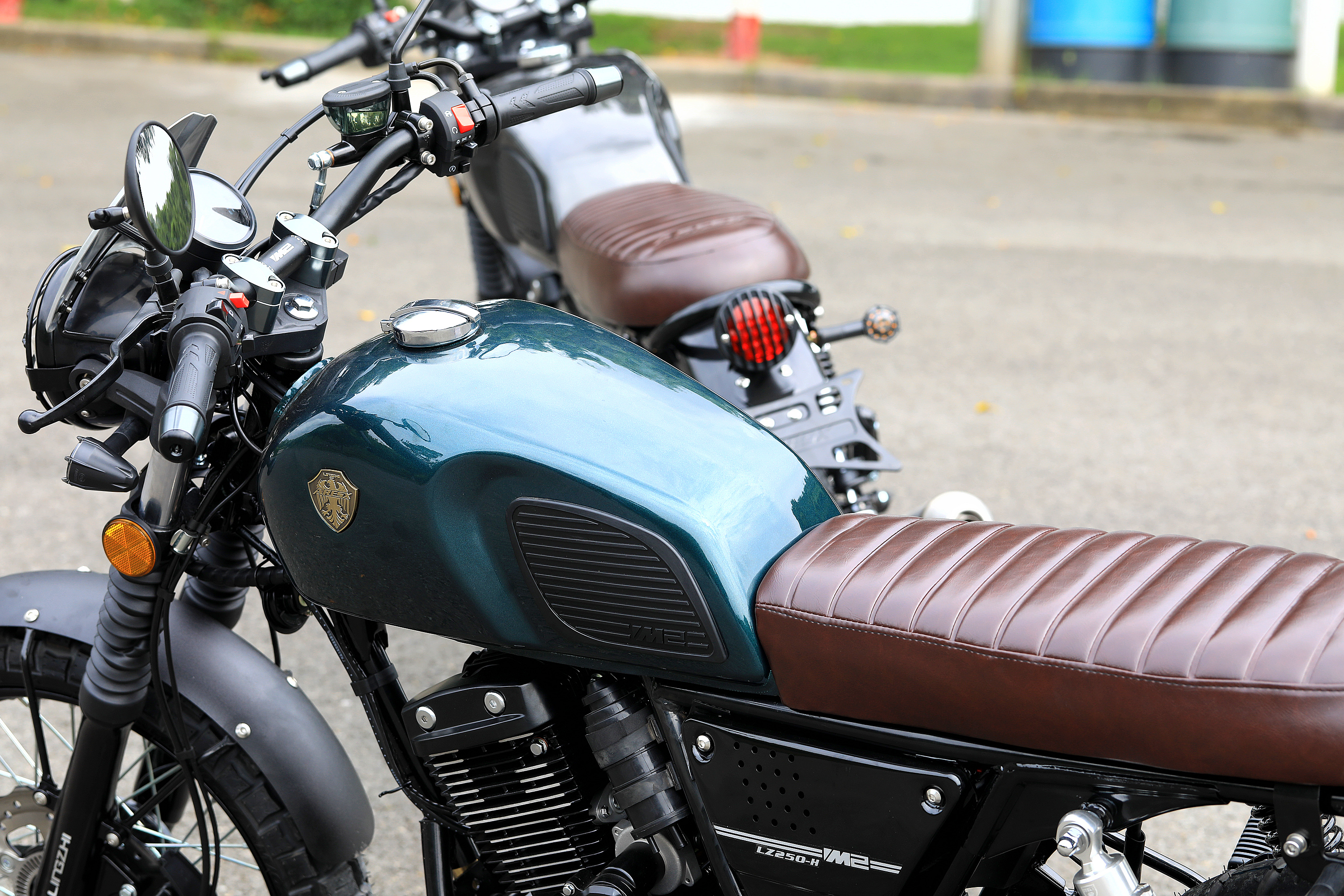 Full view of the ARESX motorcycle in teal color