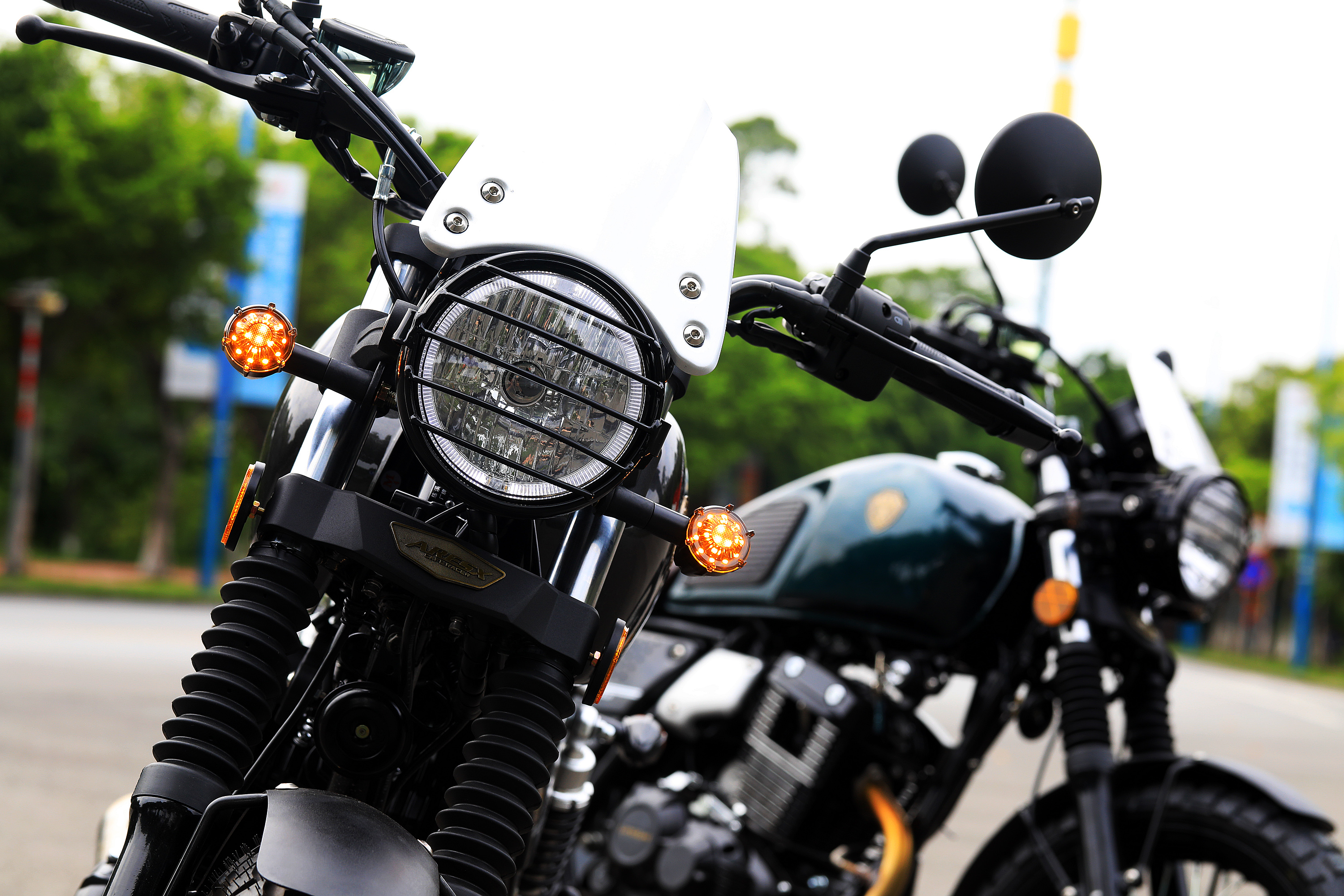 Front view of the motorcycle with retro headlight cage