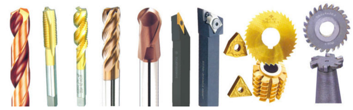 Collection of various metal cutting tools including drill bits and milling cutters