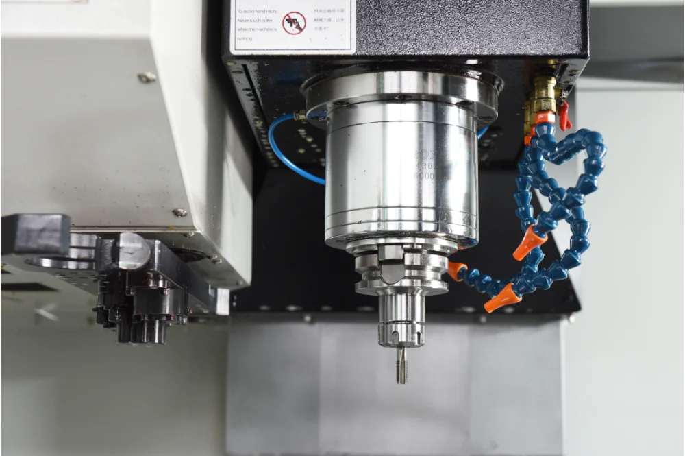 Close up of the machining area with safety warning
