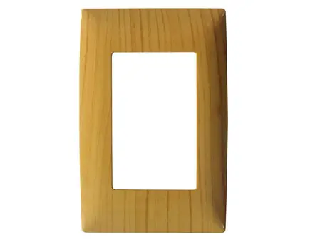 Close up of the oak electrical switch frame showing natural wood grain and rectangular cutout.
