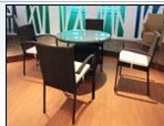 Glass Top Dining Table with Woven Chairs