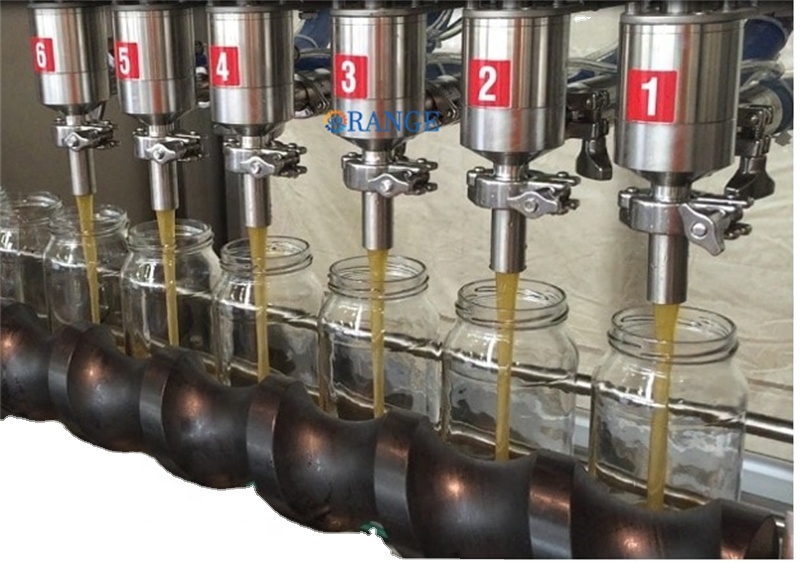Multi-head filling machine showing precise nozzle alignment