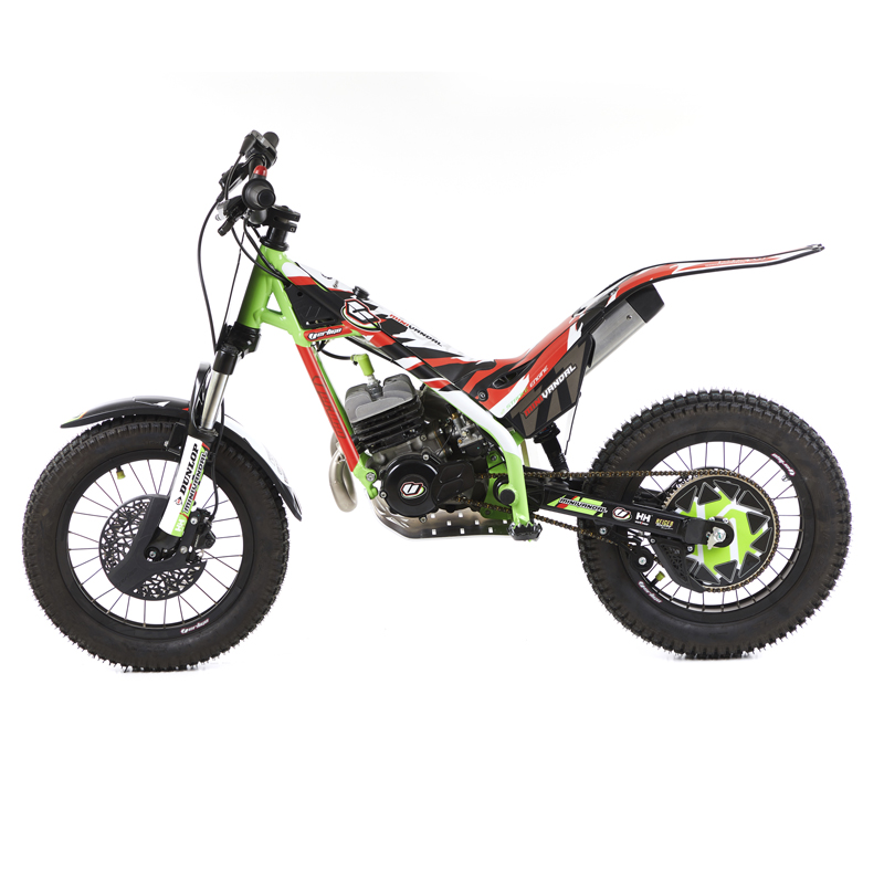 Side profile of a high-performance trials motorcycle on terrain