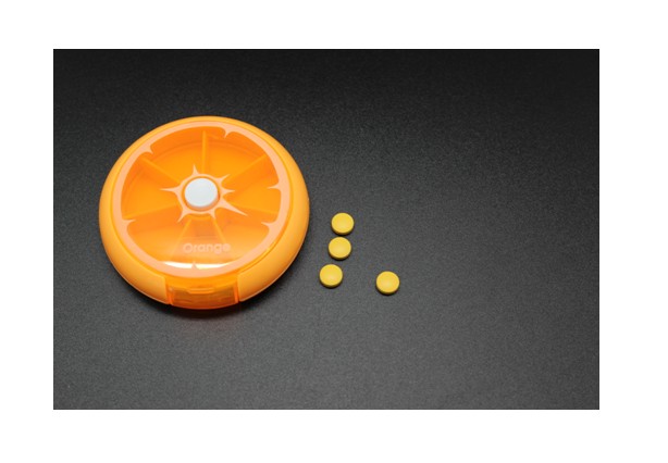 Orange slice shaped pill case