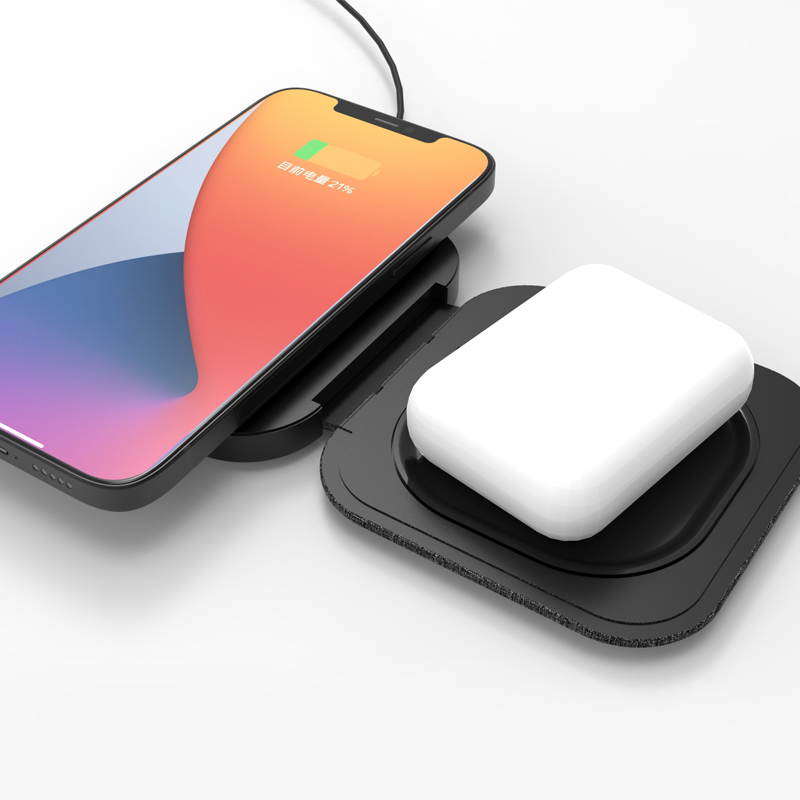 Foldable wireless charger pad in open position charging two devices