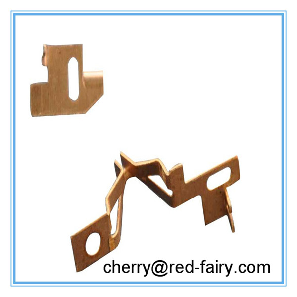 Close-up of precision-engineered copper electric meter stamping components