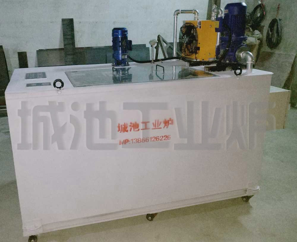 Industrial quenching salt tank showing control panel and motor assembly