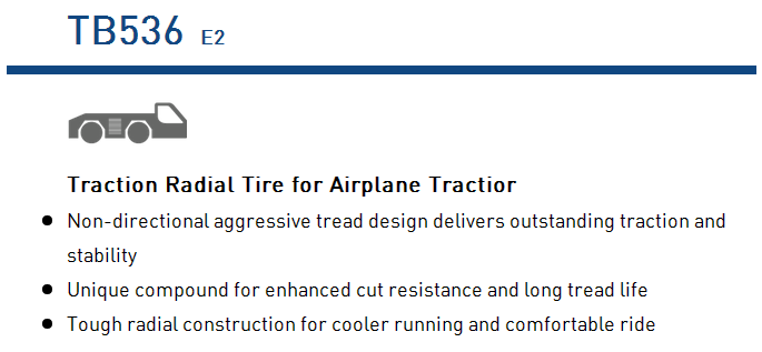 Traction radial tire designed for airplane tractors showing tread pattern and technical text