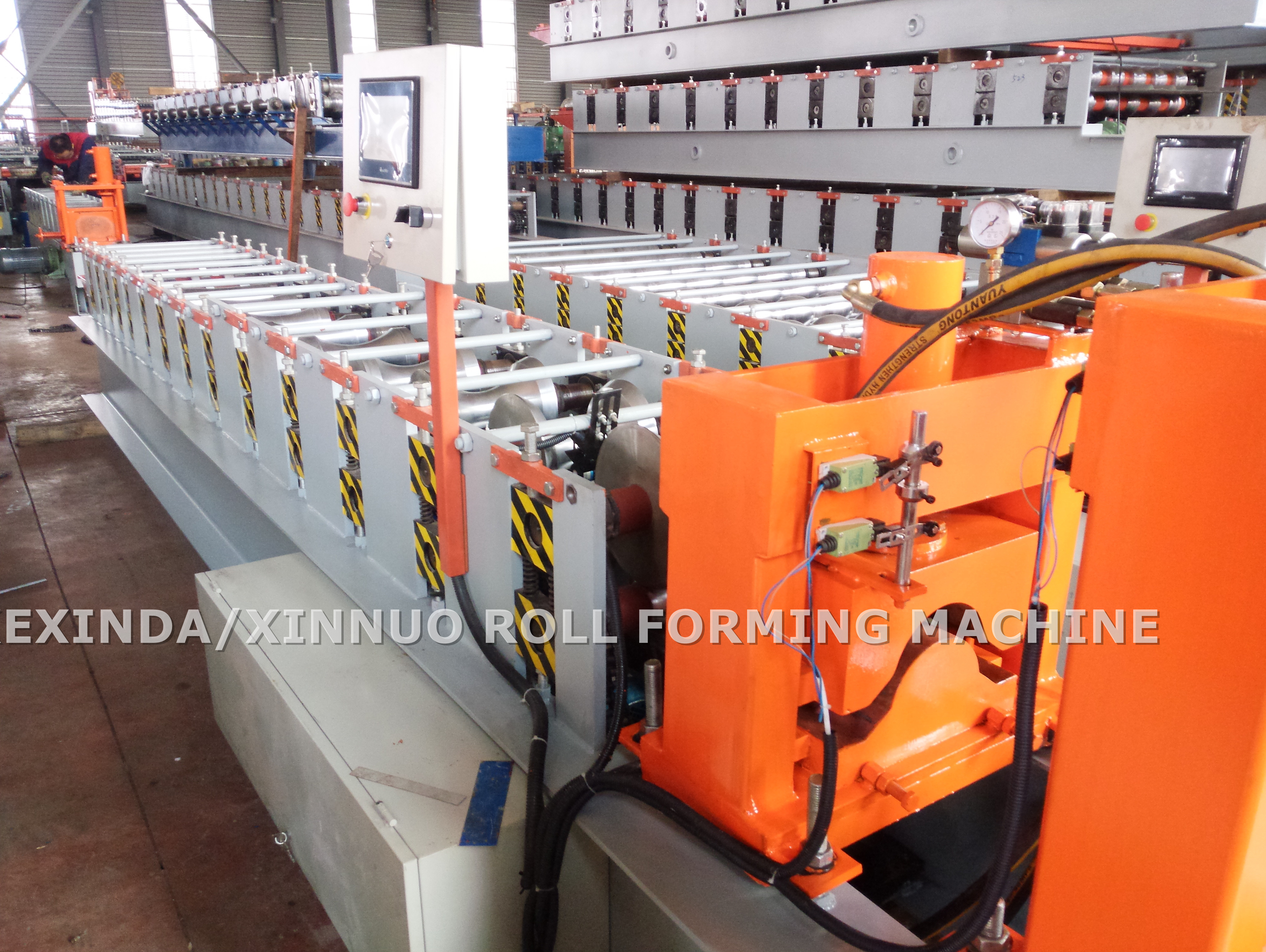 Detailed view of the roller forming stations
