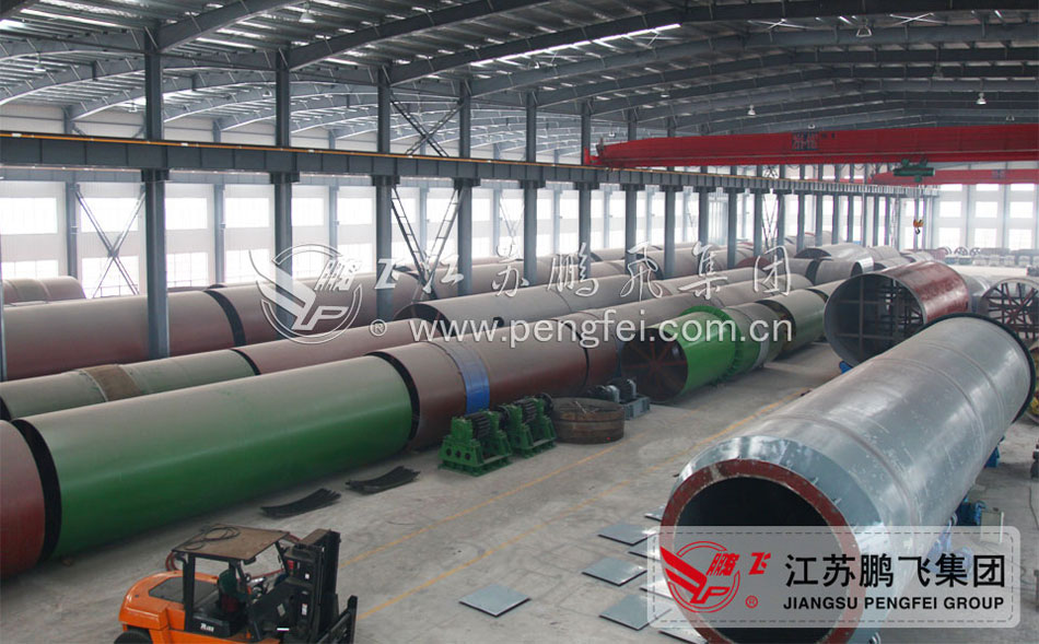 Close up of rotary kiln cylinder and external drive gearing
