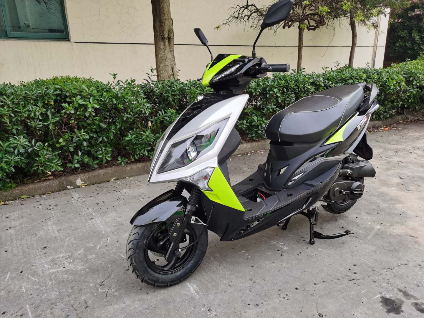Sleek Black and Silver Gas Scooter with Neon Green Accents