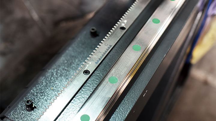 Close-up of rack and pinion guide rail system