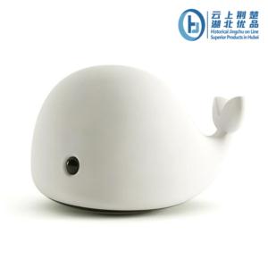Whale-themed silicone night lamp glowing softly