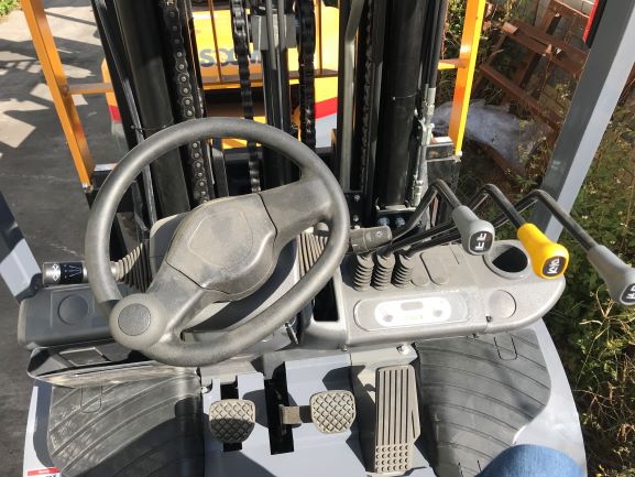 Forklift operator compartment and controls