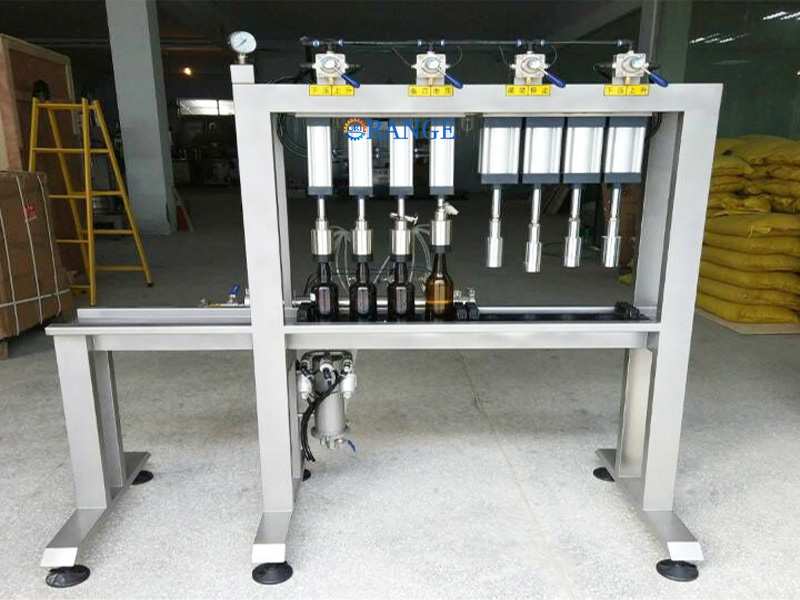 Stainless steel filling machine unit with pressure gauge and conveyor system